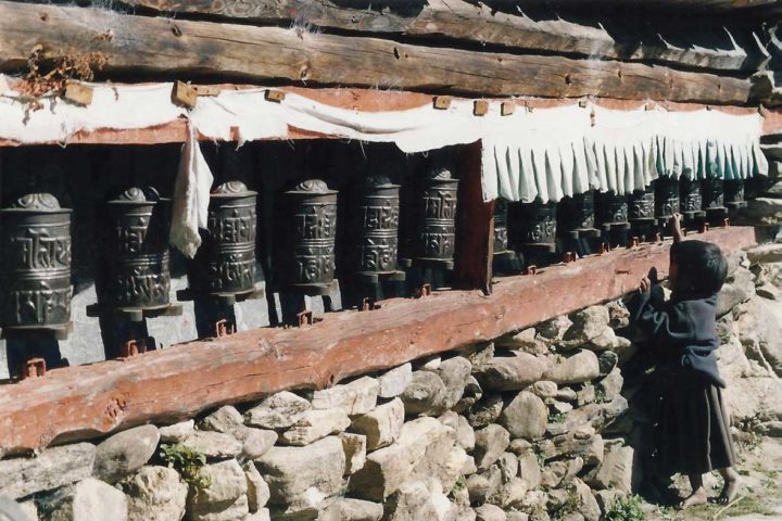 25 Things To Do During Everest Base Camp Trek Children rotating prayer wheels along the way